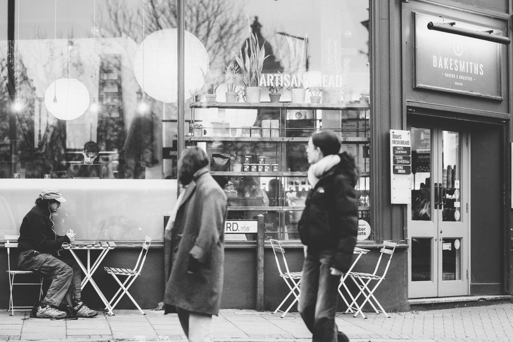 A shopfront on a Bristol high street, tables out on the pavement